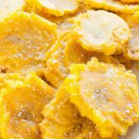 Tostones With Fried Pork · Fried Green Plantains served with Fried Pork