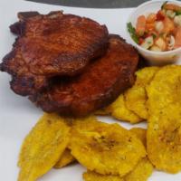 Pork Chops With Tostones · 2 Pork Chops served with Fried Green Plantains.