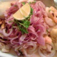 Ceviche De Mixto · Lemon marinated seafood and fish with onions.