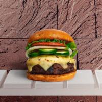 Hella Peno Here Burger · Seasoned plant-based patty topped with melted vegan cheese, jalapenos, lettuce, tomato, onio...