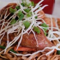 Chicken Lo Mein · Fried quarter chicken on top of flat saucy style noodles