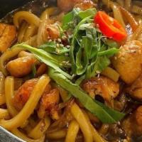 Chicken Teriyaki Udon · Stir-fried udon with chicken teriyaki and vegetable serve on a sizzling hot stone bowl