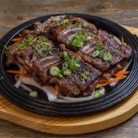 (Bbq) La Galbi · House-made traditional sweet soy, plum, ginger, pear, scallion.  and fresh citrus marinated ...