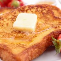 Strawberry French Toast · Sweet slices of French toast fresh off the griddle topped with strawberries and served with ...