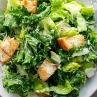 Caesar Salad · Romaine lettuce, croutons, Romano cheese, and caesar dressing.