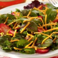 Tossed Salad · Lettuce, tomatoes, onions, green pepper, cucumber, and choice of dressing.