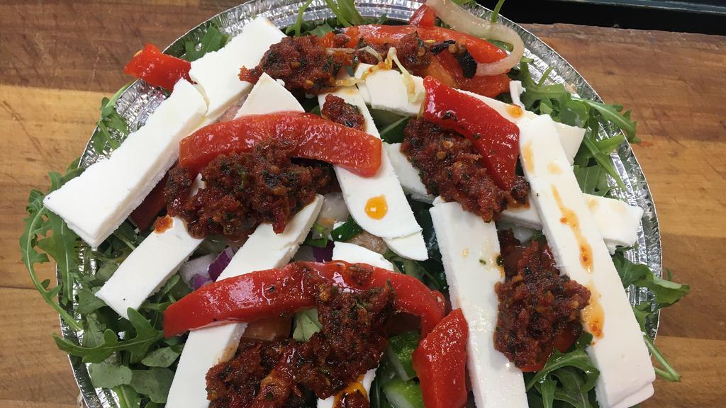 Fresh Mozzarella Salad · Fresh mozzarella cheese, roasted peppers, sun-dried tomato, lettuce, olive oil, and basil.