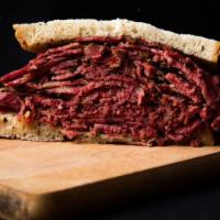 Huge Old Fashioned Pastrami Lower East Side Sandwich (P) · 14 oz. of Hot Pastrami on Rye with Mustard, Chips and Pickle