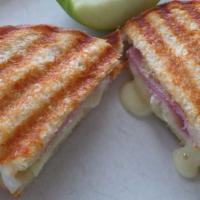 Brie Cheese Sandwich · Brie cheese with choice of turkey, ham or black forest ham with sliced green apple, and cran...