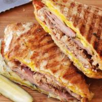 Cuban Panini · Grilled ham, melted swiss cheese, sliced pickle, and honey mustard.