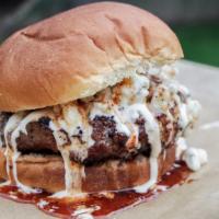 Buffalo Blue Angus Burger · Angus burger with melted pepper jack cheese topped with buffalo sauce and chunky blue cheese.