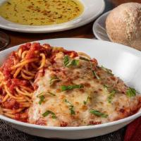 Chicken Parmesan · Pecorino Romano, mozzarella, house-made pomodoro sauce & fresh basil, served with spaghetti