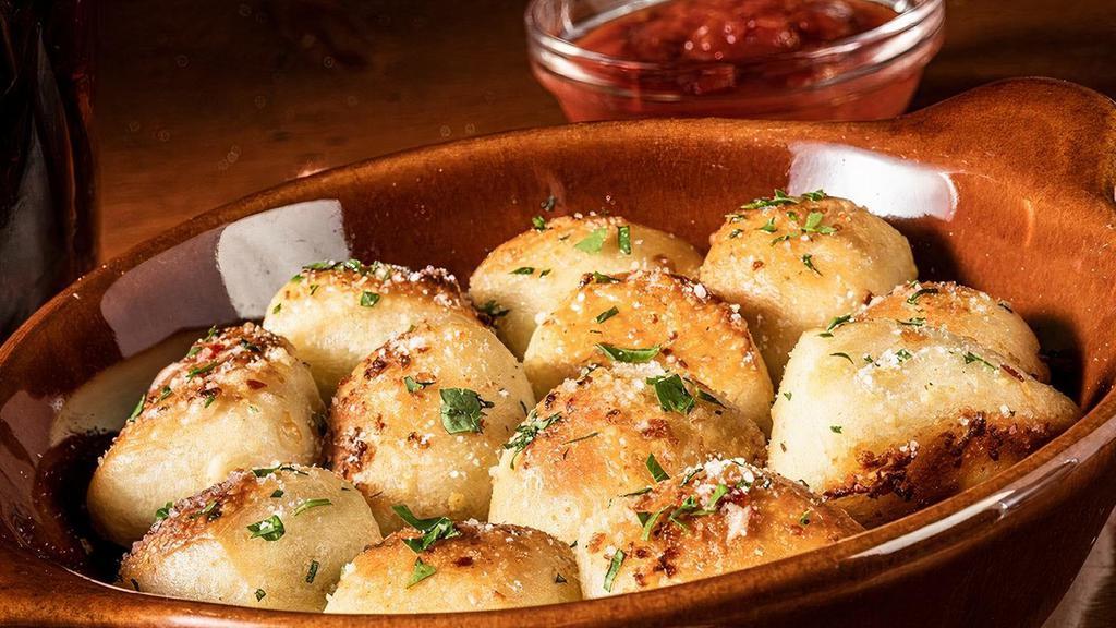 Garlic Knots · Freshly-baked dough topped with olive oil, fresh garlic, parsley & Pecorino Romano, served with house-made pomodoro.