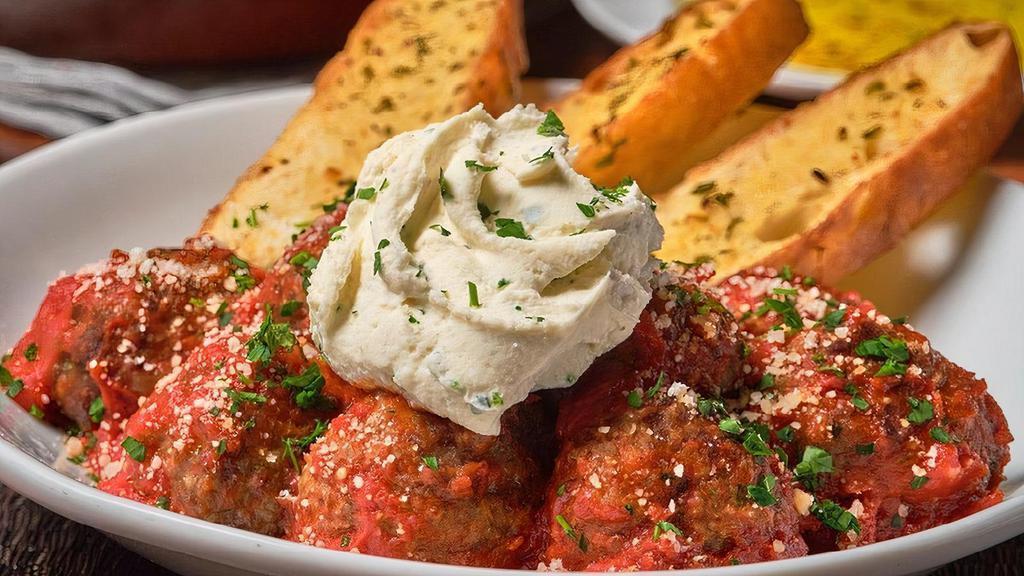Meatballs · Freshly prepared hand-crafted meatballs topped with house-made pomodoro & whipped ricotta. Served with toasted garlic focaccia.