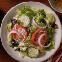 Insalata · Mixed Greens, sliced tomatoes,  cucumbers, onions, olives, pepperoncini & mozzarella.