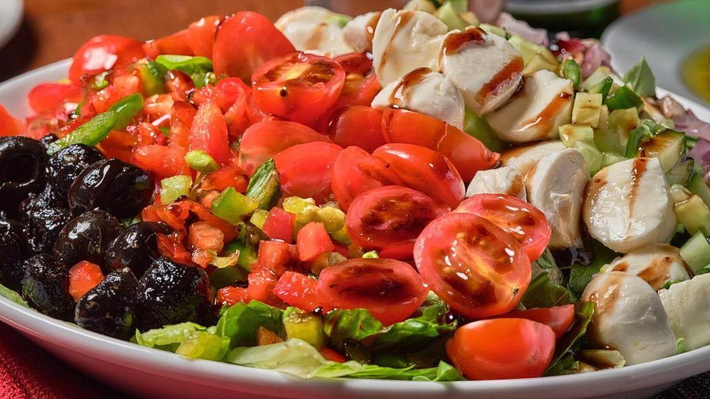 Farmhouse · Mixed greens with roasted black olives, diced peppers, cucumbers,red onions, grape tomatoes & fresh mozzarella with balsamic vinaigrette & balsamic fig glaze.