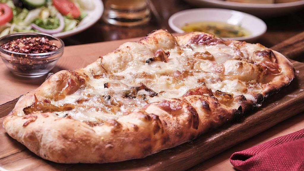 Prosciutto & Caramelized Onion · Prosciutto, caramelized onions, seasoned cream sauce, mozzarella & Pecorino Romano