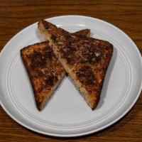 Convict · Vegemite & butter on thick cut multigrain toast.