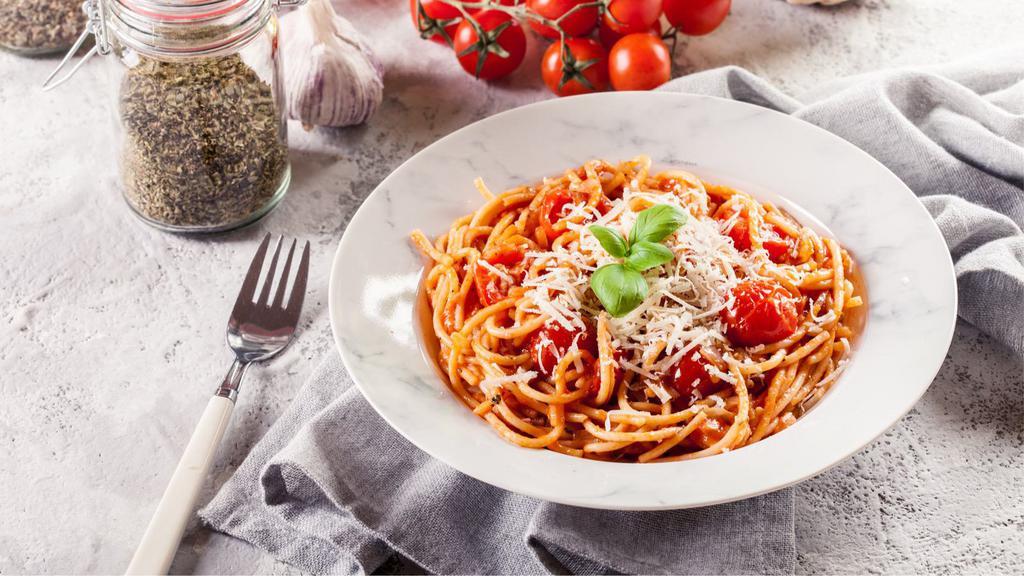 Tomato Basil Spaghetti · Spaghetti with tomato basil tomato sauce, mushrooms, cherry tomatoes, fresh parsley, and Parmesan.