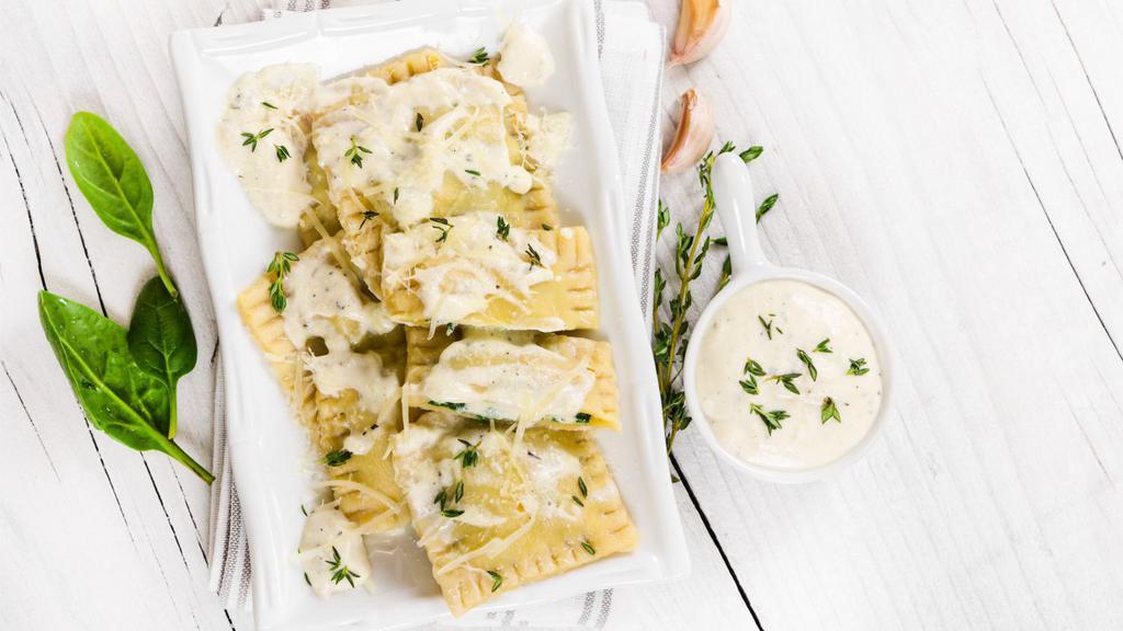 Spinach Ravioli · Delicious cheesy spinach ravioli, served with a choice of amazing sauces.