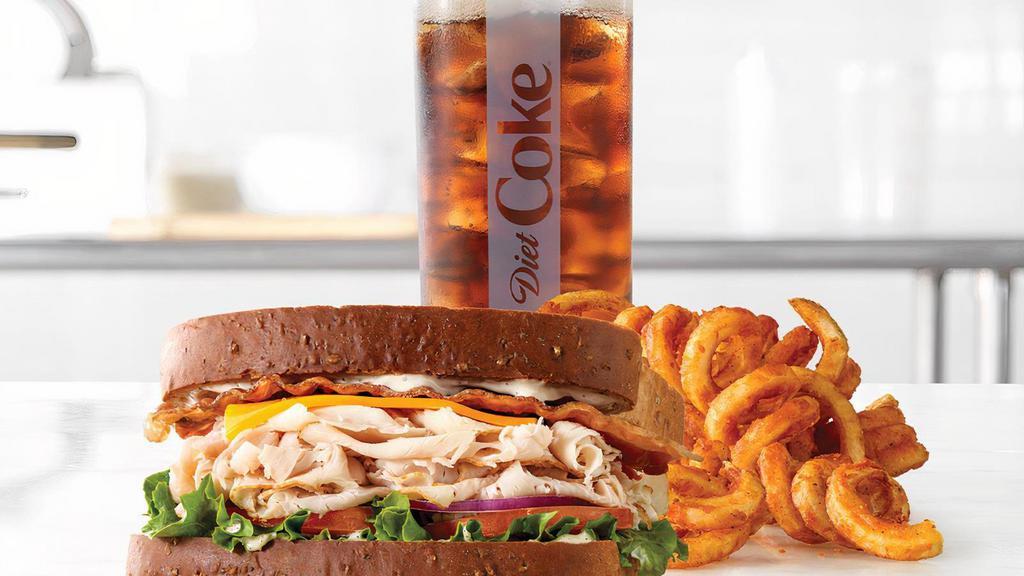 Roast Turkey Ranch & Bacon · Sliced roast turkey with pepper bacon, cheddar cheese, green leaf lettuce, tomato, red onion and parmesan peppercorn ranch sauce on thick sliced honey wheat bread. Visit arbys.com for nutritional and allergen information.