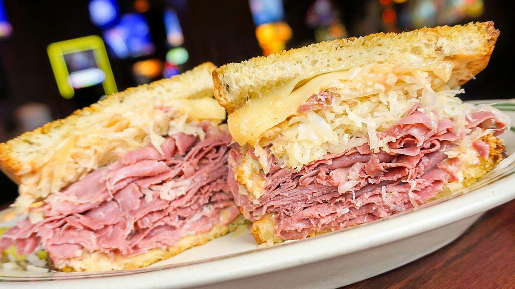 New York Grilled Reuben · Corned beef, thousand island dressing, sauerkraut and melted swiss on rye.