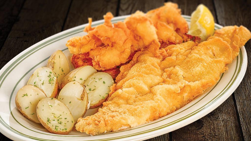 Seafood Combo · Hand breaded shrimp and lightly breaded haddock, served with choice of potato and coleslaw.