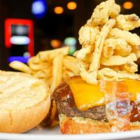 Smokehouse Burger · Bacon, cheddar cheese, BBQ sauce, sauteed red onion and Cajun mayo.