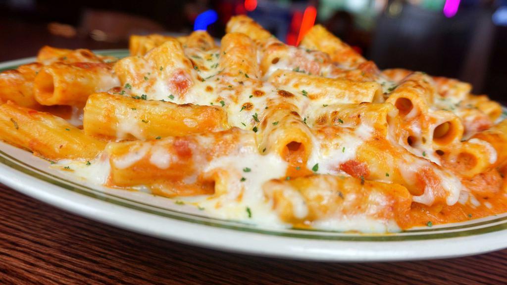 Baked Ziti · A generous portion of ziti tossed in our own marinara sauce with Romano and mozzarella cheese, then baked.