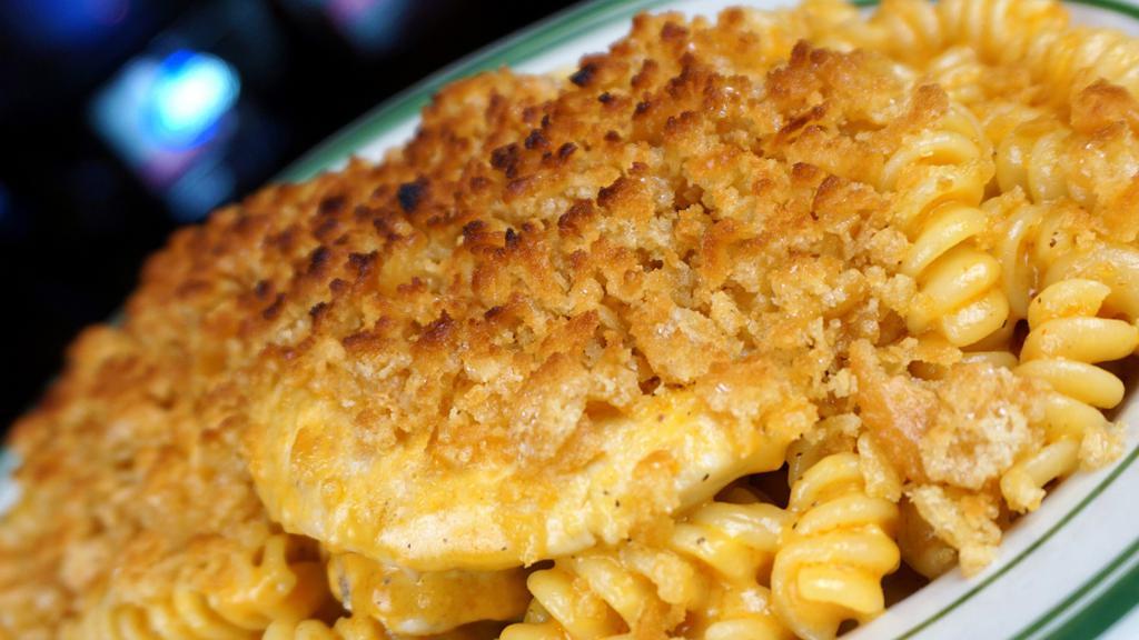 Buffalo Chicken Mac & Cheese · Tender chicken sautéed in buffalo sauce then tossed with ziti pasta and our homemade cheese sauce. Topped with butter crumb topping and melted jack-cheddar cheese. Served with garlic bread and side salad.