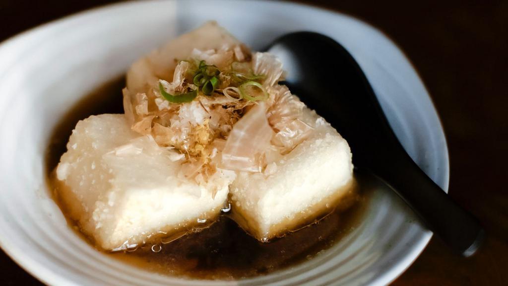 Agedashi Tofu · Light fried Soft Tofy with Bonito Flakes, Green Onions, Ginger, and Daikon served with Dashi Broth