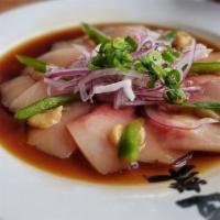 Hamachi Carpaccio · Thinly sliced hamachi sashimi garnished with jalapeño peppers, sweet miso, chili oil, red on...
