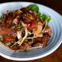 Ahi Poke · Local Hawaiian tuna, sweet onion, ogo, and macadamia nuts marinated in Doraku’s special poke...