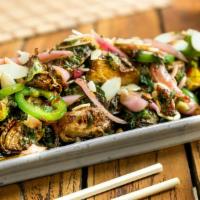 Brussel Sprouts · Tossed with almonds, chiles, mint, pickled onions, sweet and spicy sauce