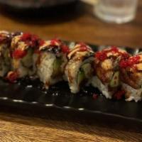 Ultimate Spicy Tuna Roll · Shrimp tempura, spicy tuna, and avocado topped with unagi, finished with kabayaki, spicy aio...