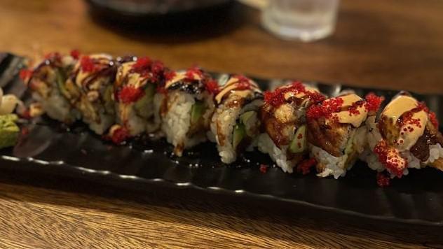 Ultimate Spicy Tuna Roll · Shrimp tempura, spicy tuna, and avocado topped with unagi, finished with kabayaki, spicy aioli, and red tobiko.