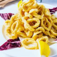 Calamari Fritti · Golden-fried rings of squid with marinara sauce.