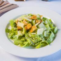 Insalata Caesare · Hearts of romaine lettuce with homemade croutons and Parmesan cheese.