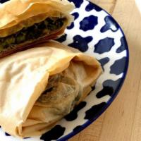 Spanakopita · Spinach and feta wrapped in phyllo dough.