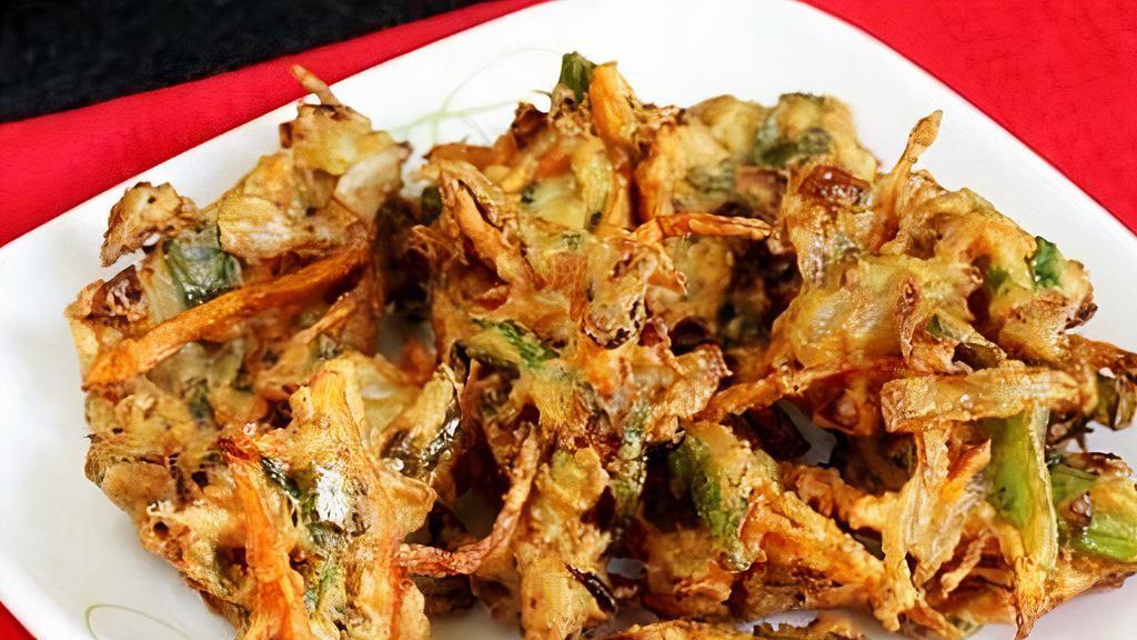 Vegetable Pakora Per Lb · 1lb  Fritters prepared with gram, flour, herbs, and spices.
