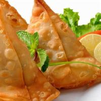 Vegetable Samosa · Crispy patties with mildly spiced potatoes and green peas.