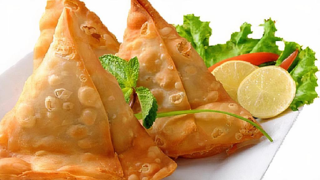 Vegetable Samosa · Crispy patties with mildly spiced potatoes and green peas.