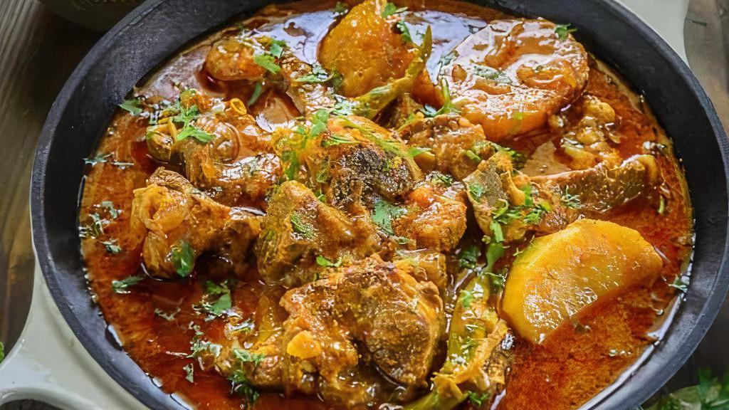 Aloo Gosht · Goat meat cooked with potatoes in aromatic herbs and spices.