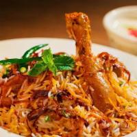 Chicken Biryani · Basmati rice cooked with chicken with flavor.