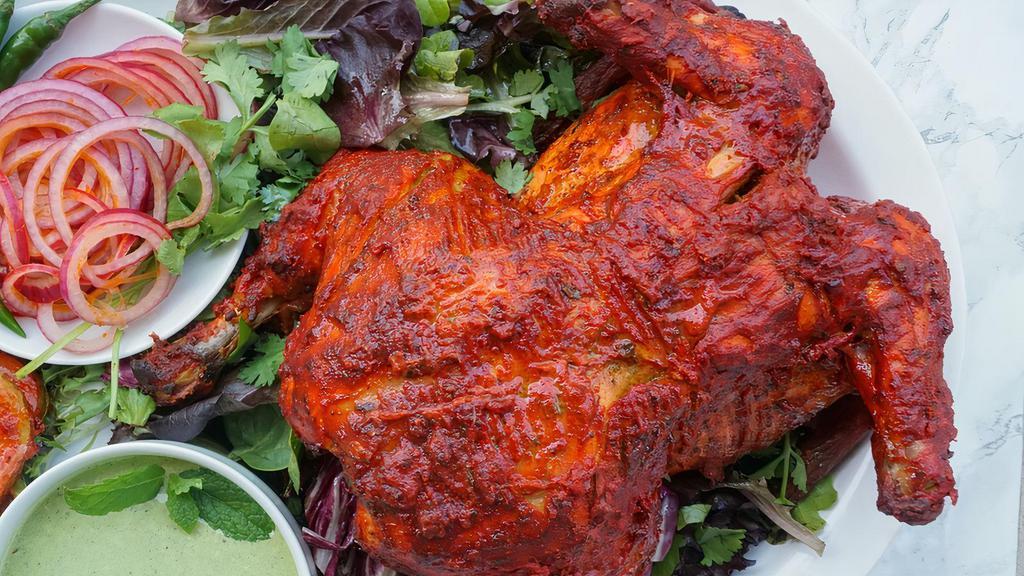Chicken Tandoori Full · Whole chicken marinated with herbs and barbecued in a clay oven.