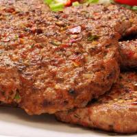Chicken Chapli Kabab · Grilled ground chicken patty mixed with spices and chopped onion.