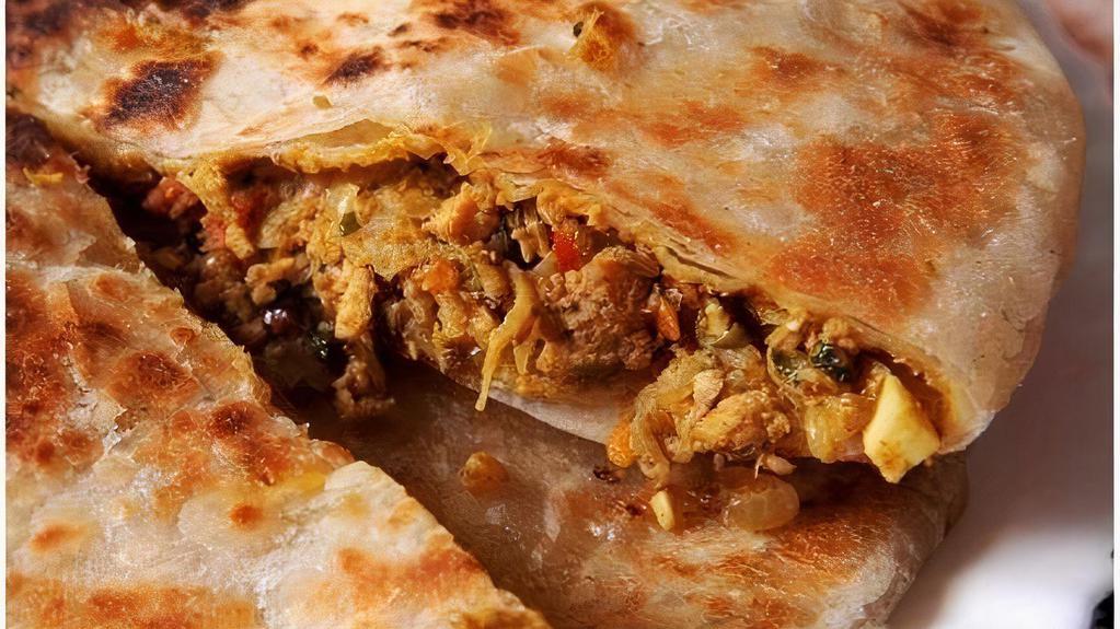Keema Naan · White flour bread filled with ground chicken freshly baked in tandoor oven.
