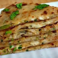 Aloo Paratha · Soft white flour bread filled with potato freshly made on tawa griddle.