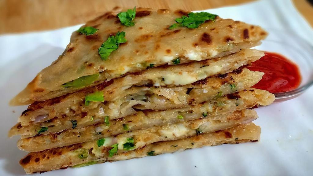 Aloo Paratha · Soft white flour bread filled with potato freshly made on tawa griddle.