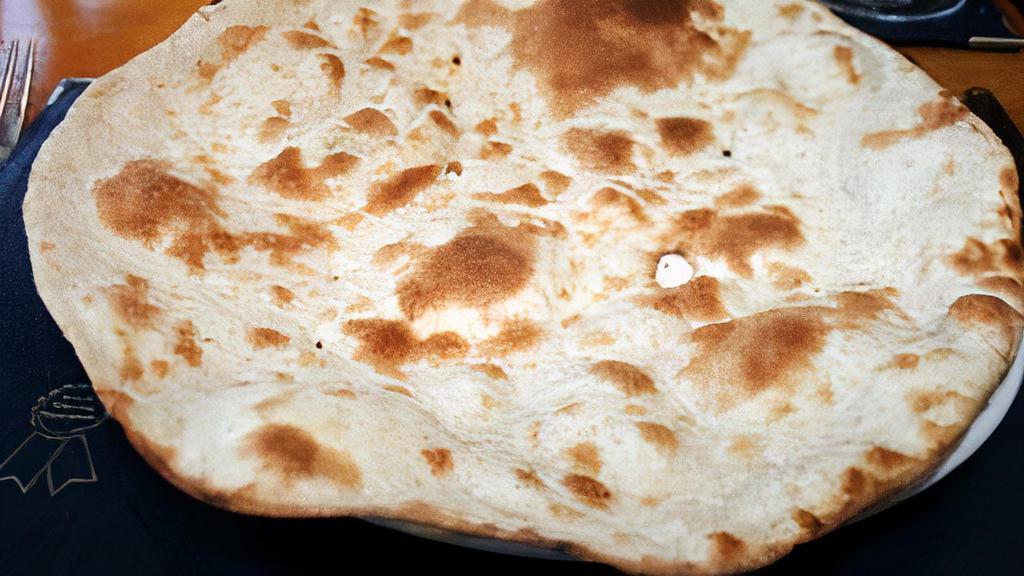 Roti · Whole wheat bread freshly baked in clay oven (tandoor).